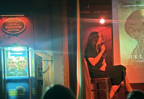 Dana's side of the stage during the show, and offstage to the left, Liz and Lou, their puppets fashioned after their likenesses, are displayed in a clear tubular case with a spotlight on them.
